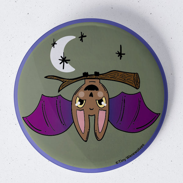 Based in Chicago by queer artist & designer Kayla Pekkala - Tiny Werewolves | Bat Spooky 1.75" Button Pin in | Shop to get your Metal Pinback Button with collections featuring retro-inspired designs infused with social commentary art, highlighting modern social & current events.