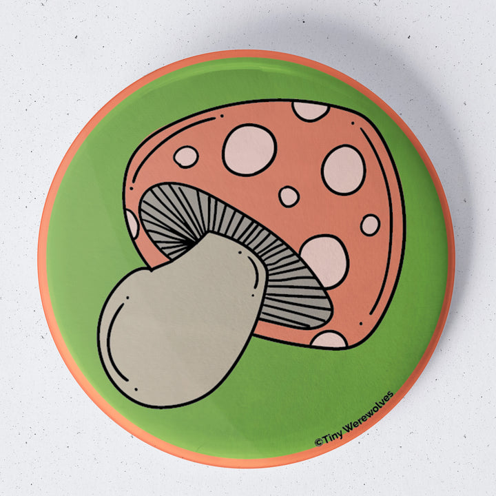 Based in Chicago by queer artist & designer Kayla Pekkala - Tiny Werewolves | Mushroom 1.75" Button Pin in | Shop to get your Metal Pinback Button with collections featuring retro-inspired designs infused with social commentary art, highlighting modern social & current events.