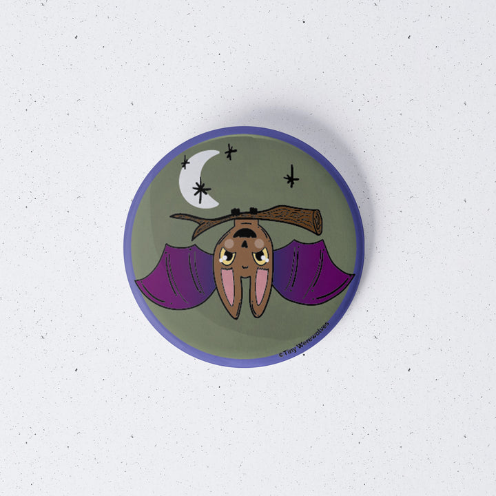Based in Chicago by queer artist & designer Kayla Pekkala - Tiny Werewolves | Bat Spooky 1" Mini Button Pin in | Shop to get your Metal Pinback Button with collections featuring retro-inspired designs infused with social commentary art, highlighting modern social & current events.