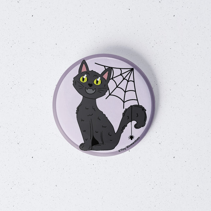 Based in Chicago by queer artist & designer Kayla Pekkala - Tiny Werewolves | Black Cat Spooky 1" Mini Button Pin in | Shop to get your Metal Pinback Button with collections featuring retro-inspired designs infused with social commentary art, highlighting modern social & current events.