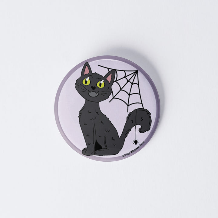 Based in Chicago by queer artist & designer Kayla Pekkala - Tiny Werewolves | Black Cat Spooky 1" Mini Button Pin in | Shop to get your Metal Pinback Button with collections featuring retro-inspired designs infused with social commentary art, highlighting modern social & current events.
