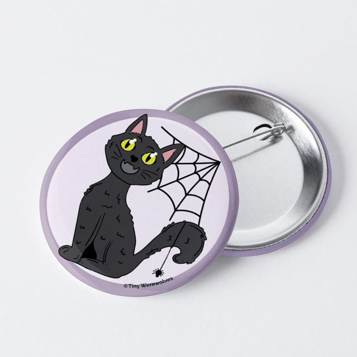 Based in Chicago by queer artist & designer Kayla Pekkala - Tiny Werewolves | Black Cat Spooky 1" Mini Button Pin in 1" Mini Pin | Shop to get your Metal Pinback Button with collections featuring retro-inspired designs infused with social commentary art, highlighting modern social & current events.