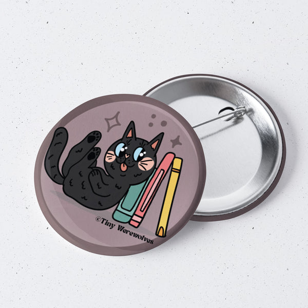 Based in Chicago by queer artist & designer Kayla Pekkala - Tiny Werewolves | Black Book Cat 1" Mini Button Pin in | Shop to get your Metal Pinback Button with collections featuring retro-inspired designs infused with social commentary art, highlighting modern social & current events.