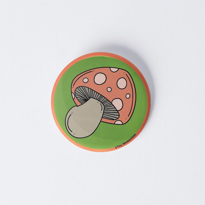 Based in Chicago by queer artist & designer Kayla Pekkala - Tiny Werewolves | Mushroom 1" Mini Button Pin in | Shop to get your Metal Pinback Button with collections featuring retro-inspired designs infused with social commentary art, highlighting modern social & current events.