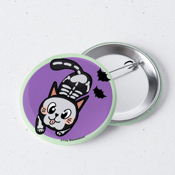 Based in Chicago by queer artist & designer Kayla Pekkala - Tiny Werewolves | SkeliCat Spooky 1" Mini Button Pin in | Shop to get your Metal Pinback Button with collections featuring retro-inspired designs infused with social commentary art, highlighting modern social & current events.