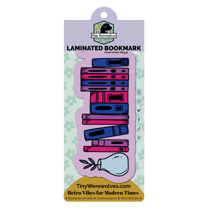 Based in Chicago by queer artist & designer Kayla Pekkala - Tiny Werewolves | Bisexual Bookshelf Pride Laminated Printed Bookmark in | Shop to get your Laminated Bookmark with collections featuring retro-inspired designs infused with social commentary art, highlighting modern social & current events.