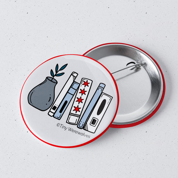 Based in Chicago by queer artist & designer Kayla Pekkala - Tiny Werewolves | Chicago Flag Bookshelf 1" Mini Button Pin in | Shop to get your Metal Pinback Button with collections featuring retro-inspired designs infused with social commentary art, highlighting modern social & current events.
