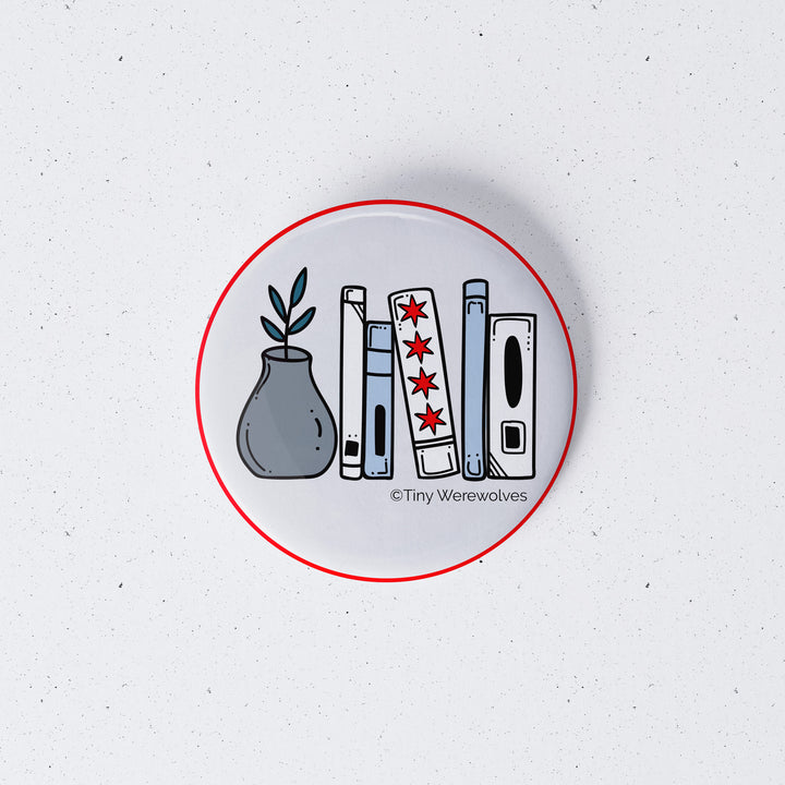 Based in Chicago by queer artist & designer Kayla Pekkala - Tiny Werewolves | Chicago Flag Bookshelf 1" Mini Button Pin in | Shop to get your Metal Pinback Button with collections featuring retro-inspired designs infused with social commentary art, highlighting modern social & current events.