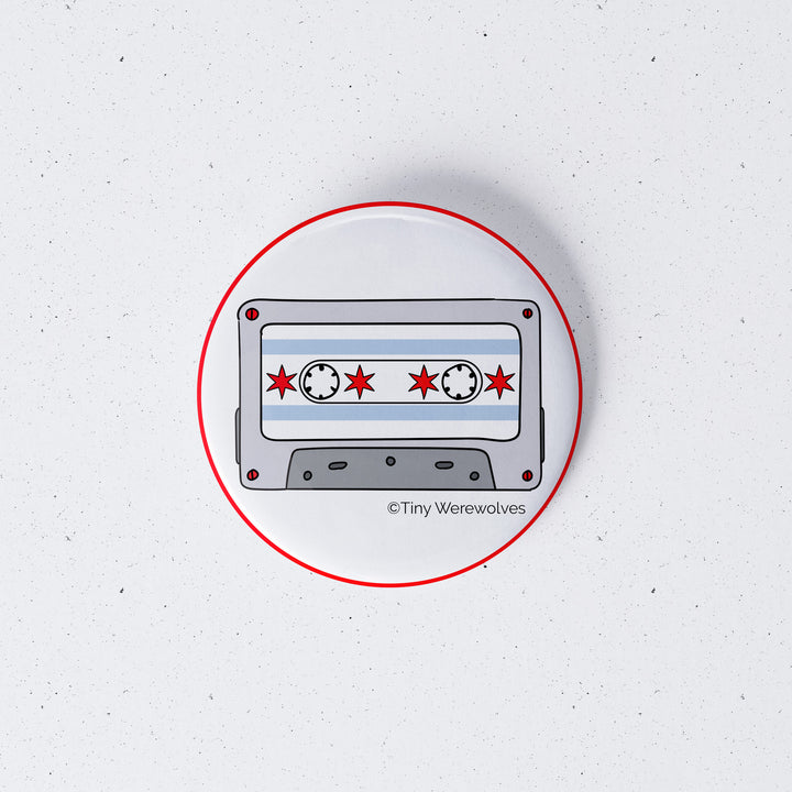 Based in Chicago by queer artist & designer Kayla Pekkala - Tiny Werewolves | Chicago Flag Cassette Tape 1" Mini Button Pin in | Shop to get your Metal Pinback Button with collections featuring retro-inspired designs infused with social commentary art, highlighting modern social & current events.