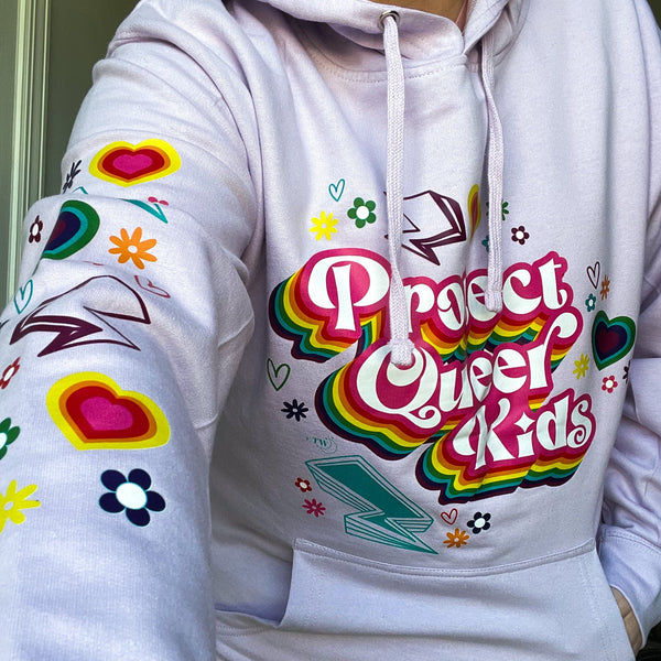 Based in Chicago by queer artist & designer Kayla Pekkala - Tiny Werewolves | Protect Queer Kids Midweight Printed Sleeve Pullover Hoodie in | Shop to get your Pullover Hoodie with collections featuring retro-inspired designs infused with social commentary art, highlighting modern social & current events.