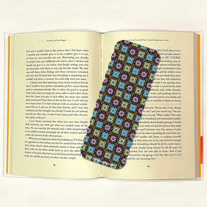 Based in Chicago by queer artist & designer Kayla Pekkala - Tiny Werewolves | Granny Square Laminated Printed Bookmark in | Shop to get your Laminated Bookmark with collections featuring retro-inspired designs infused with social commentary art, highlighting modern social & current events.