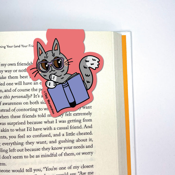 Based in Chicago by queer artist & designer Kayla Pekkala - Tiny Werewolves | Grey Book Cat Laminated Magnetic Bookmark in | Shop to get your Magnetic Bookmark with collections featuring retro-inspired designs infused with social commentary art, highlighting modern social & current events.