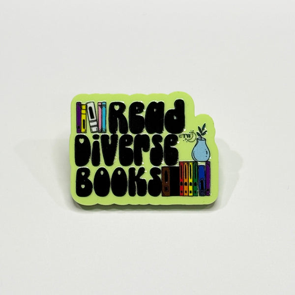 Based in Chicago by queer artist & designer Kayla Pekkala - Tiny Werewolves | Read Diverse Books Acrylic Pin in Lime | Shop to get your Acrylic Pin with collections featuring retro-inspired designs infused with social commentary art, highlighting modern social & current events.
