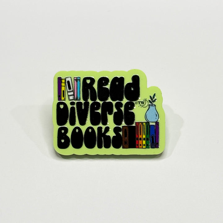 Based in Chicago by queer artist & designer Kayla Pekkala - Tiny Werewolves | Read Diverse Books Acrylic Pin in Lime | Shop to get your Acrylic Pin with collections featuring retro-inspired designs infused with social commentary art, highlighting modern social & current events.
