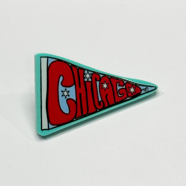 Based in Chicago by queer artist & designer Kayla Pekkala - Tiny Werewolves | Chicago Pennant Acrylic Pin in Aqua | Shop to get your Acrylic Pin with collections featuring retro-inspired designs infused with social commentary art, highlighting modern social & current events.