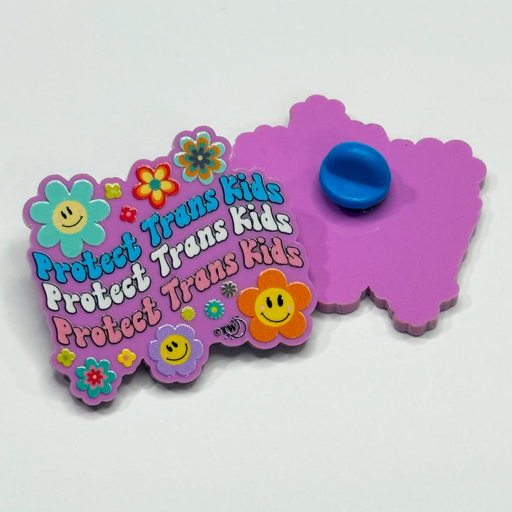 Based in Chicago by queer artist & designer Kayla Pekkala - Tiny Werewolves | Retro Flowers Protect Trans Kids Acrylic Pin in | Shop to get your Acrylic Pin with collections featuring retro-inspired designs infused with social commentary art, highlighting modern social & current events.