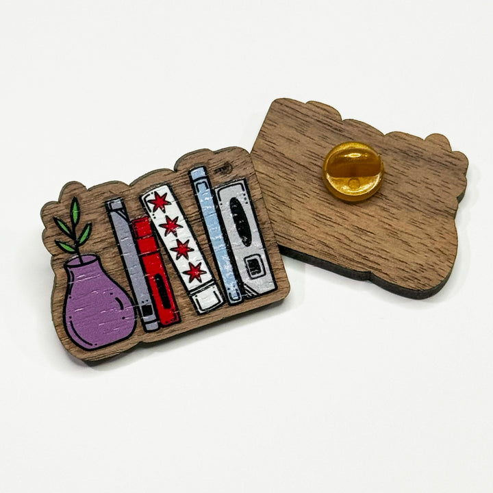 Based in Chicago by queer artist & designer Kayla Pekkala - Tiny Werewolves | Chicago Flag Bookshelf Wood Pin in | Shop to get your Wood Pin with collections featuring retro-inspired designs infused with social commentary art, highlighting modern social & current events.