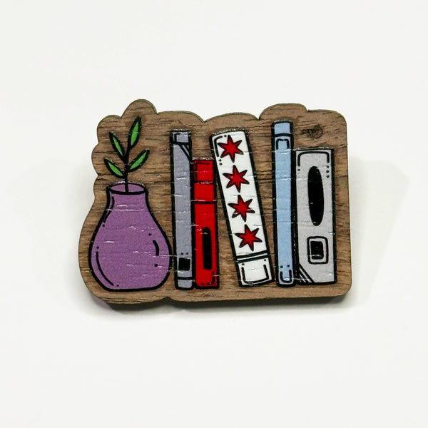 Based in Chicago by queer artist & designer Kayla Pekkala - Tiny Werewolves | Chicago Flag Bookshelf Wood Pin in Walnut | Shop to get your Wood Pin with collections featuring retro-inspired designs infused with social commentary art, highlighting modern social & current events.
