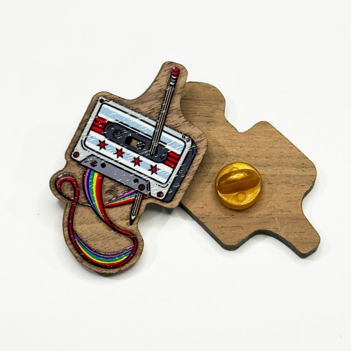 Based in Chicago by queer artist & designer Kayla Pekkala - Tiny Werewolves | Chicago Rewind Cassette Tape Wood Pin in | Shop to get your Wood Pin with collections featuring retro-inspired designs infused with social commentary art, highlighting modern social & current events.