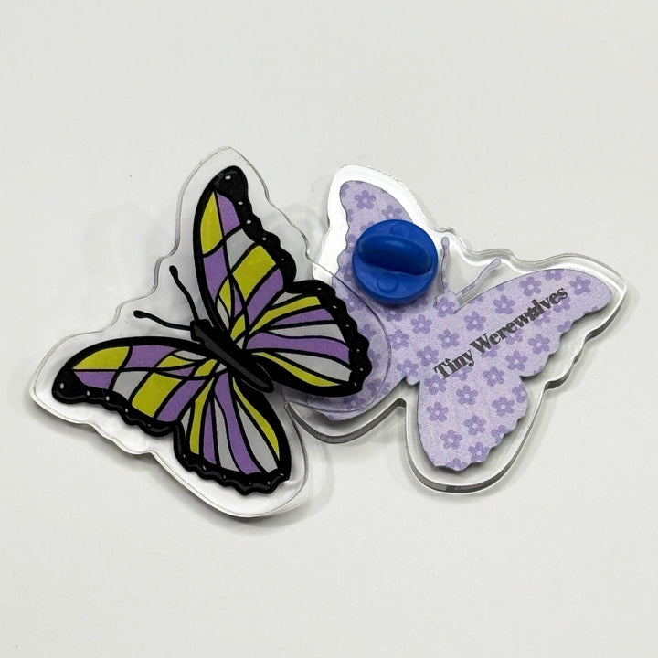 Based in Chicago by queer artist & designer Kayla Pekkala - Tiny Werewolves | Non-Binary Pastel Subtle Queer Butterfly Acrylic Pin in | Shop to get your Acrylic Pin with collections featuring retro-inspired designs infused with social commentary art, highlighting modern social & current events.
