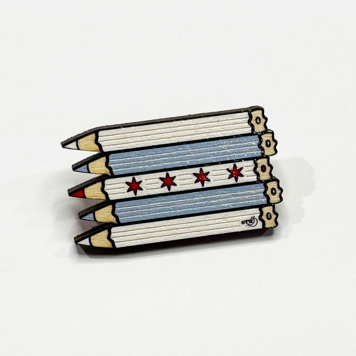 Based in Chicago by queer artist & designer Kayla Pekkala - Tiny Werewolves | Chicago Pencils Flag Wood Pin in | Shop to get your Wood Pin with collections featuring retro-inspired designs infused with social commentary art, highlighting modern social & current events.