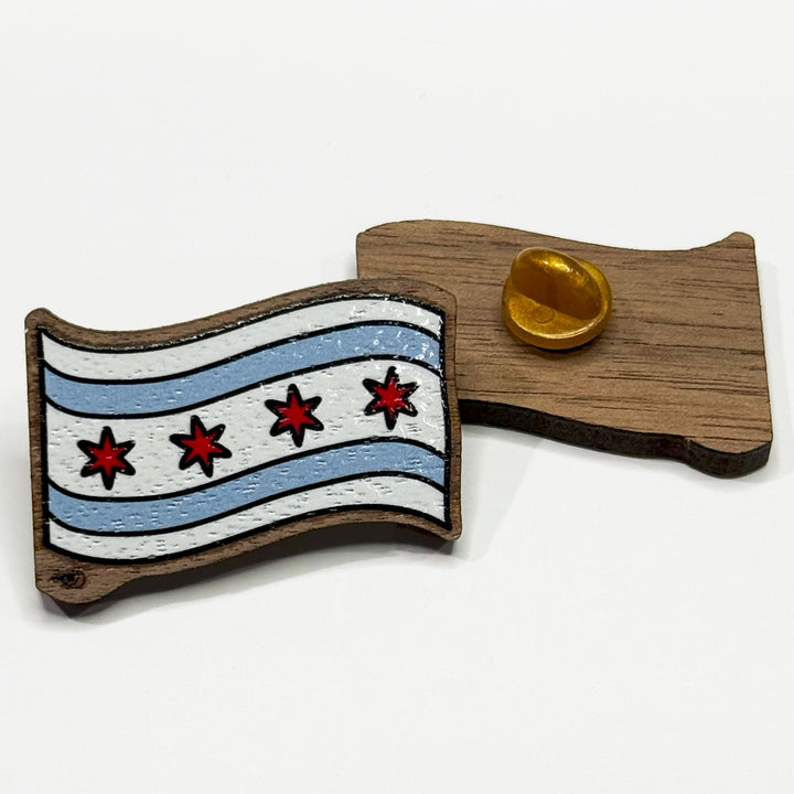 Based in Chicago by queer artist & designer Kayla Pekkala - Tiny Werewolves | Chicago Flag Wood Pin in | Shop to get your Wood Pin with collections featuring retro-inspired designs infused with social commentary art, highlighting modern social & current events.
