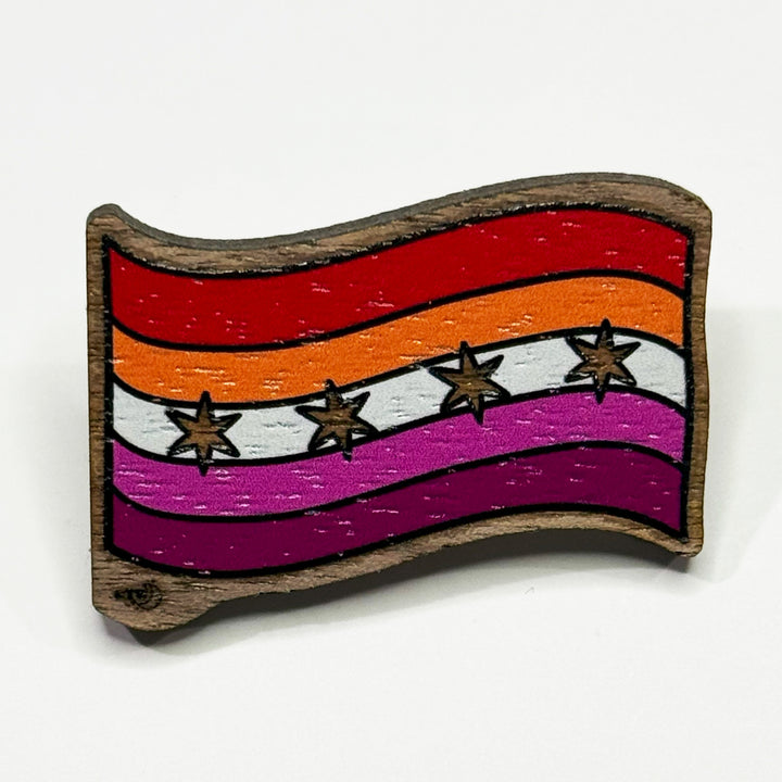 Based in Chicago by queer artist & designer Kayla Pekkala - Tiny Werewolves | Chicago Lesbian Pride Flag Wood Pin in Walnut | Shop to get your Wood Pin with collections featuring retro-inspired designs infused with social commentary art, highlighting modern social & current events.