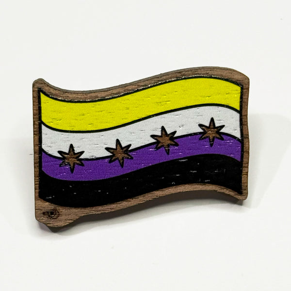 Based in Chicago by queer artist & designer Kayla Pekkala - Tiny Werewolves | Chicago Non-Binary Pride Flag Wood Pin in Walnut | Shop to get your Wood Pin with collections featuring retro-inspired designs infused with social commentary art, highlighting modern social & current events.