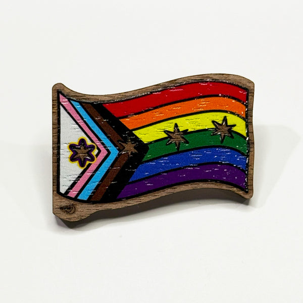Based in Chicago by queer artist & designer Kayla Pekkala - Tiny Werewolves | Chicago Progressive Intersex-Inclusive Pride Flag Wood Pin in Walnut | Shop to get your Wood Pin with collections featuring retro-inspired designs infused with social commentary art, highlighting modern social & current events.