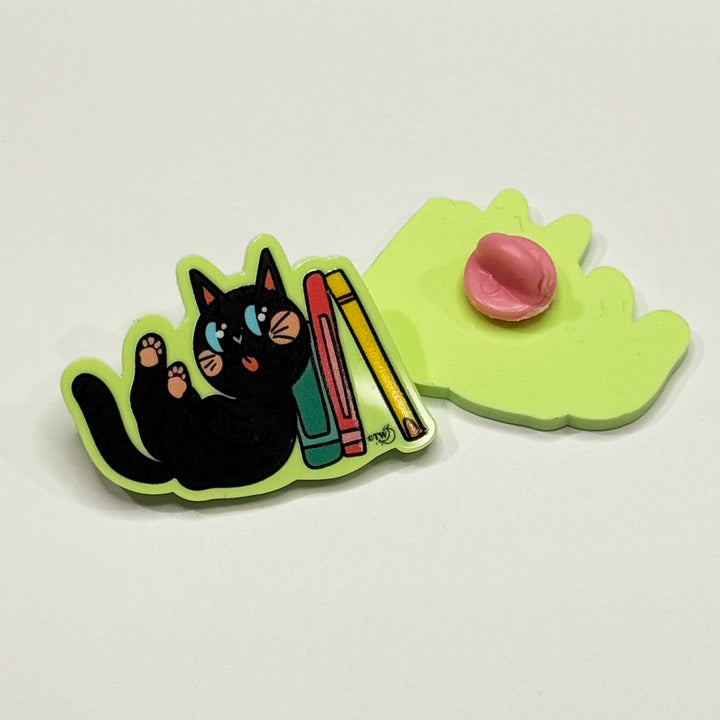 Based in Chicago by queer artist & designer Kayla Pekkala - Tiny Werewolves | Black Book Cat Acrylic Pin in | Shop to get your Acrylic Pin with collections featuring retro-inspired designs infused with social commentary art, highlighting modern social & current events.