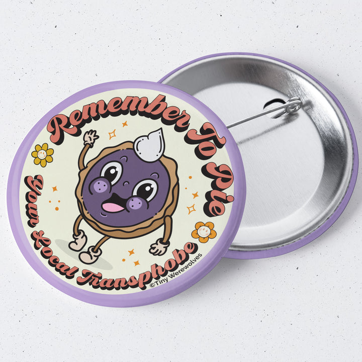 Based in Chicago by queer artist & designer Kayla Pekkala - Tiny Werewolves | Pie Your Local Transphobe 1.75" Button Pin in | Shop to get your Metal Pinback Button with collections featuring retro-inspired designs infused with social commentary art, highlighting modern social & current events.
