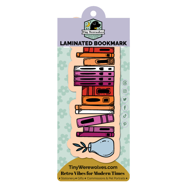 Based in Chicago by queer artist & designer Kayla Pekkala - Tiny Werewolves | Lesbian Bookshelf Pride Laminated Printed Bookmark in | Shop to get your Laminated Bookmark with collections featuring retro-inspired designs infused with social commentary art, highlighting modern social & current events.