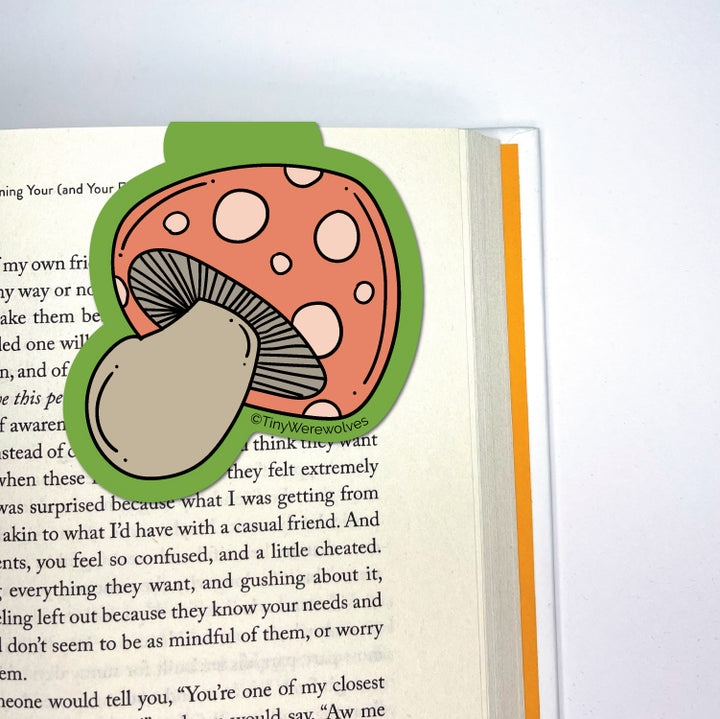 Based in Chicago by queer artist & designer Kayla Pekkala - Tiny Werewolves | Mushroom Laminated Magnetic Bookmark in | Shop to get your Magnetic Bookmark with collections featuring retro-inspired designs infused with social commentary art, highlighting modern social & current events.