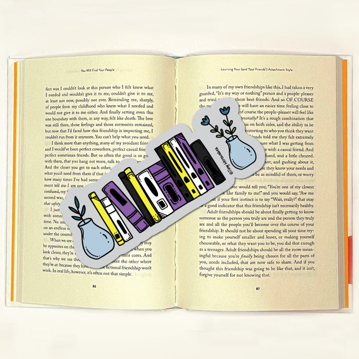 Based in Chicago by queer artist & designer Kayla Pekkala - Tiny Werewolves | Non-Binary Bookshelf Pride Laminated Printed Bookmark in | Shop to get your Laminated Bookmark with collections featuring retro-inspired designs infused with social commentary art, highlighting modern social & current events.