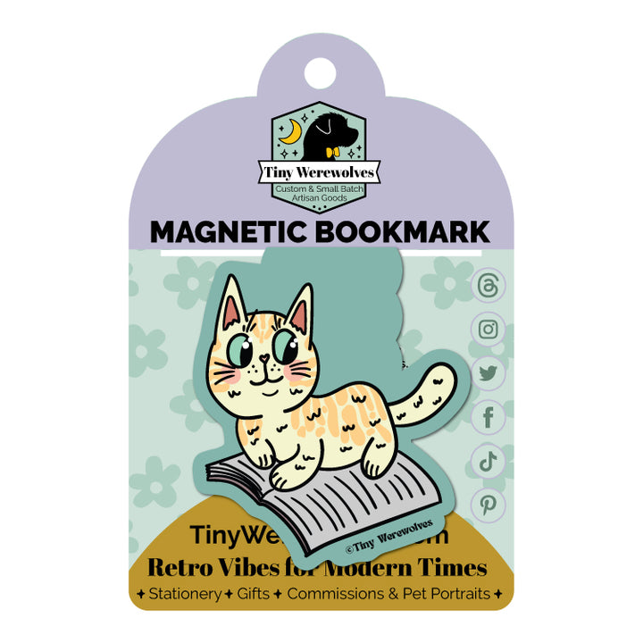 Based in Chicago by queer artist & designer Kayla Pekkala - Tiny Werewolves | Orange Book Cat Laminated Magnetic Bookmark in | Shop to get your Magnetic Bookmark with collections featuring retro-inspired designs infused with social commentary art, highlighting modern social & current events.