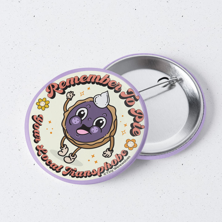 Based in Chicago by queer artist & designer Kayla Pekkala - Tiny Werewolves | Pie Your Local Transphobe 1" Mini Button Pin in | Shop to get your Metal Pinback Button with collections featuring retro-inspired designs infused with social commentary art, highlighting modern social & current events.