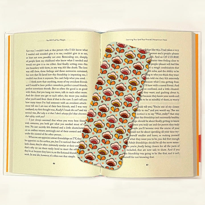 Based in Chicago by queer artist & designer Kayla Pekkala - Tiny Werewolves | Retro Flower Laminated Printed Bookmark in | Shop to get your Laminated Bookmark with collections featuring retro-inspired designs infused with social commentary art, highlighting modern social & current events.