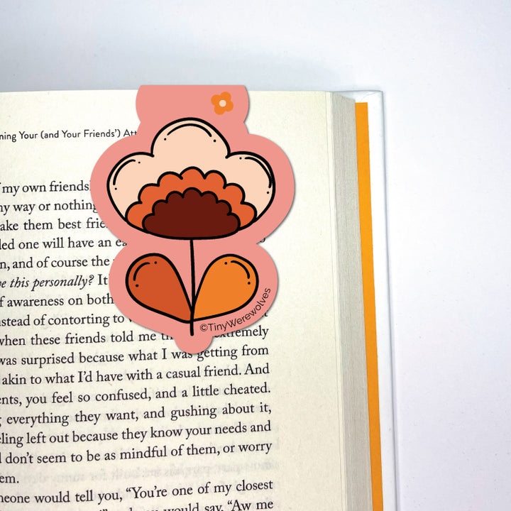 Based in Chicago by queer artist & designer Kayla Pekkala - Tiny Werewolves | Retro Flower Laminated Magnetic Bookmark in | Shop to get your Magnetic Bookmark with collections featuring retro-inspired designs infused with social commentary art, highlighting modern social & current events.