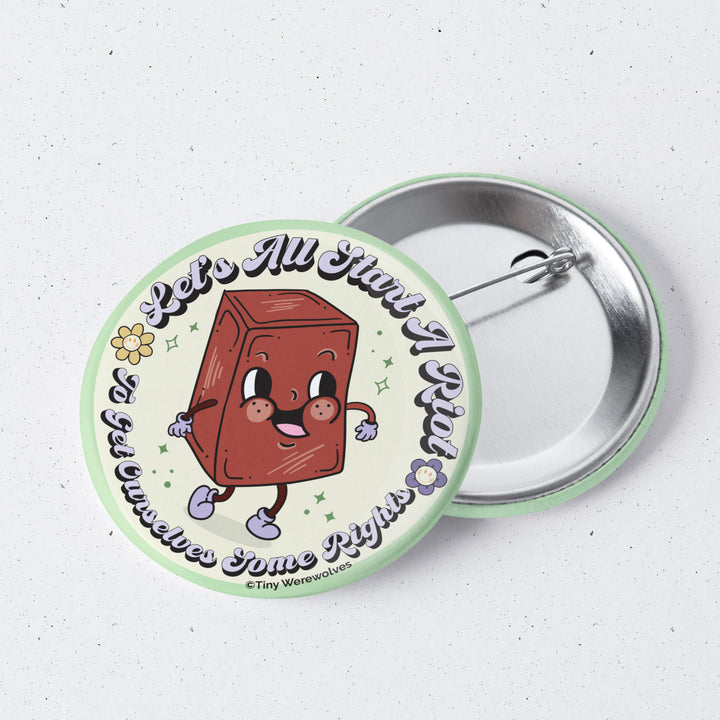 Based in Chicago by queer artist & designer Kayla Pekkala - Tiny Werewolves | Let's All Start A Riot 1" Mini Button Pin in | Shop to get your Metal Pinback Button with collections featuring retro-inspired designs infused with social commentary art, highlighting modern social & current events.