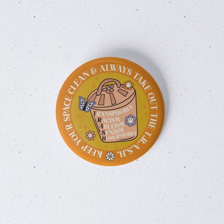 Based in Chicago by queer artist & designer Kayla Pekkala - Tiny Werewolves | Take Out The T.R.A.S.H. 1" Mini Button Pin in | Shop to get your Metal Pinback Button with collections featuring retro-inspired designs infused with social commentary art, highlighting modern social & current events.