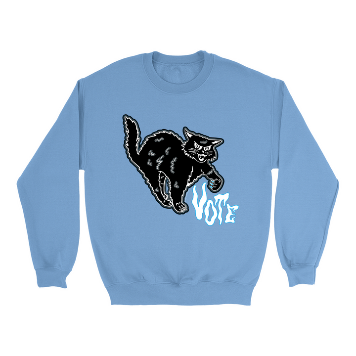 Based in Chicago by queer artist & designer Kayla Pekkala - Tiny Werewolves | Retro Spooky Cat Vote Crew Sweatshirt in Carolina Blue | Shop to get your Crew with collections featuring retro-inspired designs infused with social commentary art, highlighting modern social & current events.