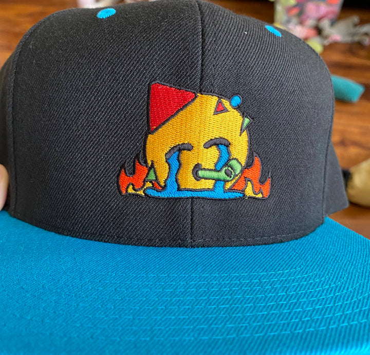 Based in Chicago by queer artist & designer Kayla Pekkala - Tiny Werewolves | Chaotic Party Emoji Embroidered Snapback in | Shop to get your Snapback with collections featuring retro-inspired designs infused with social commentary art, highlighting modern social & current events.