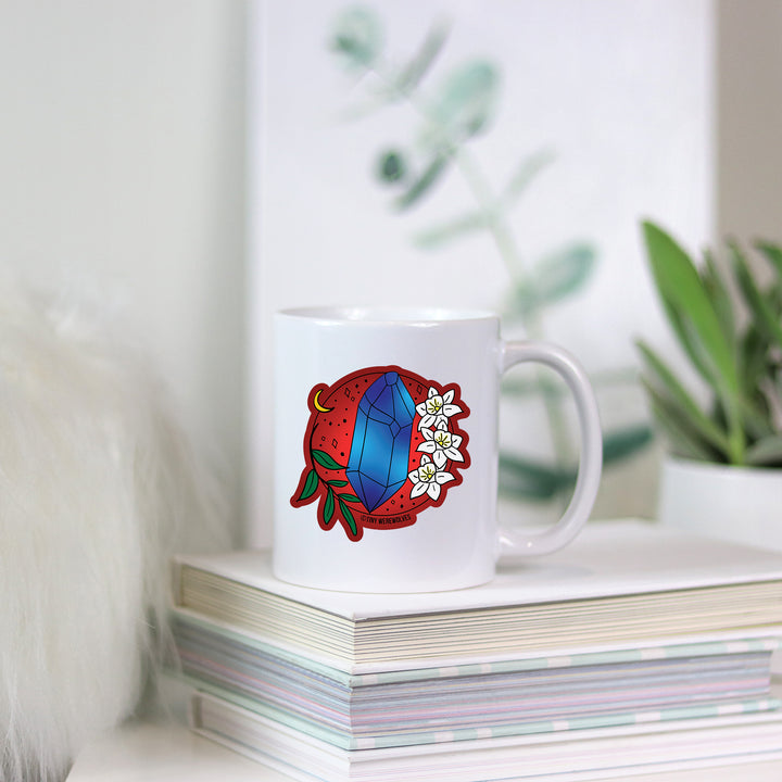 Based in Chicago by queer artist & designer Kayla Pekkala - Tiny Werewolves | December Crystal & Flower Birthstone Mug in | Shop to get your Mug with collections featuring retro-inspired designs infused with social commentary art, highlighting modern social & current events.