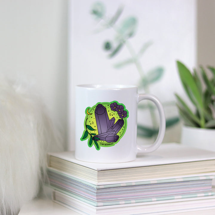 Based in Chicago by queer artist & designer Kayla Pekkala - Tiny Werewolves | February Crystal & Flower Birthstone Mug in | Shop to get your Mug with collections featuring retro-inspired designs infused with social commentary art, highlighting modern social & current events.