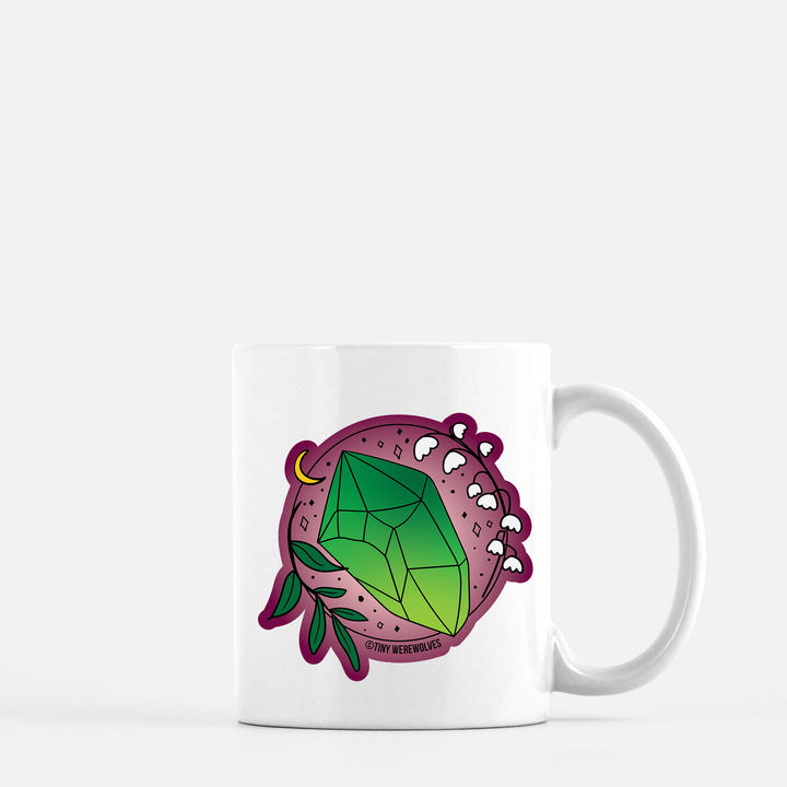 Based in Chicago by queer artist & designer Kayla Pekkala - Tiny Werewolves | May Crystal & Flower Birthstone Mug in 11 oz | Shop to get your Mug with collections featuring retro-inspired designs infused with social commentary art, highlighting modern social & current events.