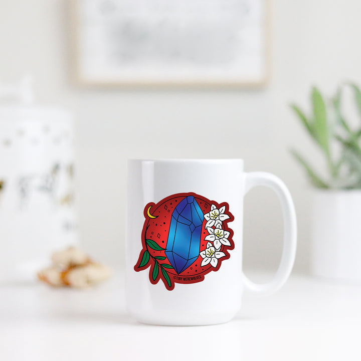 Based in Chicago by queer artist & designer Kayla Pekkala - Tiny Werewolves | December Crystal & Flower Birthstone Mug in | Shop to get your Mug with collections featuring retro-inspired designs infused with social commentary art, highlighting modern social & current events.