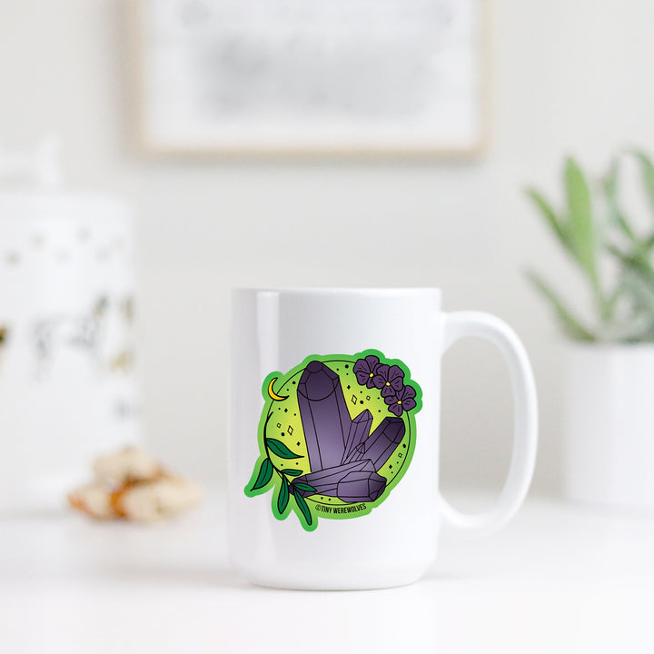 Based in Chicago by queer artist & designer Kayla Pekkala - Tiny Werewolves | February Crystal & Flower Birthstone Mug in | Shop to get your Mug with collections featuring retro-inspired designs infused with social commentary art, highlighting modern social & current events.