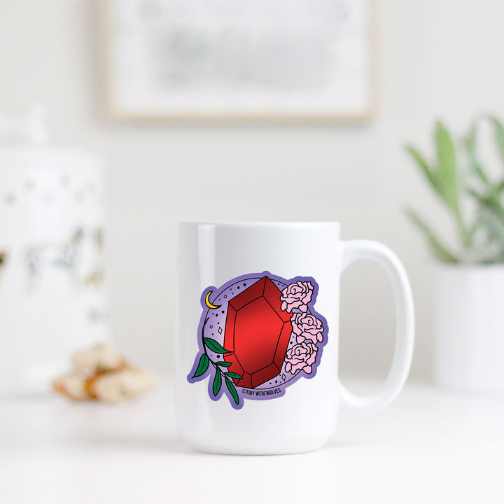 Based in Chicago by queer artist & designer Kayla Pekkala - Tiny Werewolves | January Crystal & Flower Birthstone Mug in | Shop to get your Mug with collections featuring retro-inspired designs infused with social commentary art, highlighting modern social & current events.