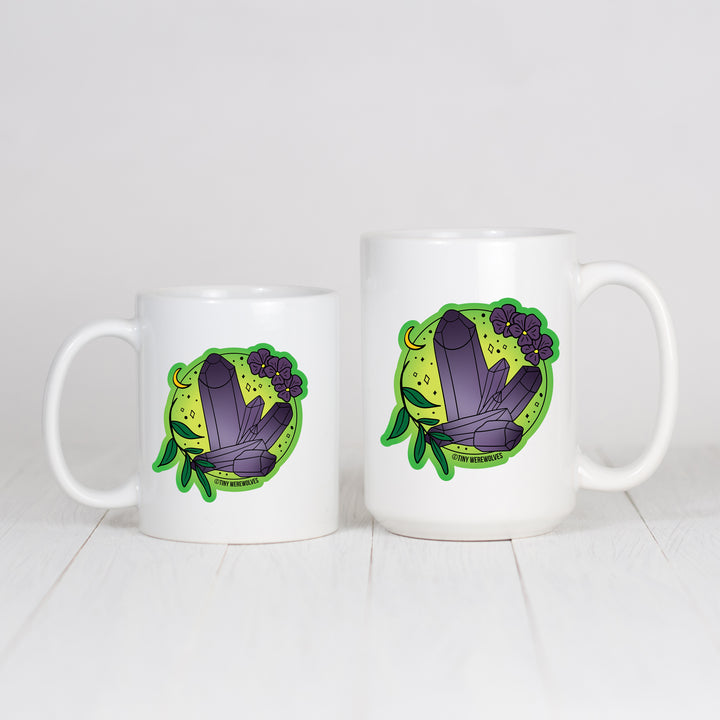 Based in Chicago by queer artist & designer Kayla Pekkala - Tiny Werewolves | February Crystal & Flower Birthstone Mug in | Shop to get your Mug with collections featuring retro-inspired designs infused with social commentary art, highlighting modern social & current events.