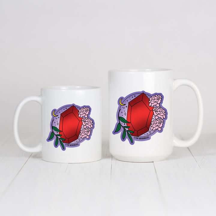 Based in Chicago by queer artist & designer Kayla Pekkala - Tiny Werewolves | January Crystal & Flower Birthstone Mug in | Shop to get your Mug with collections featuring retro-inspired designs infused with social commentary art, highlighting modern social & current events.